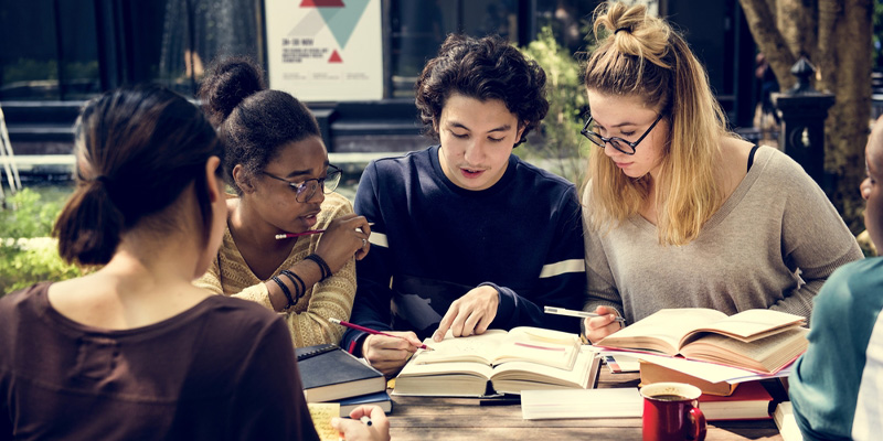 A group of university students studying together