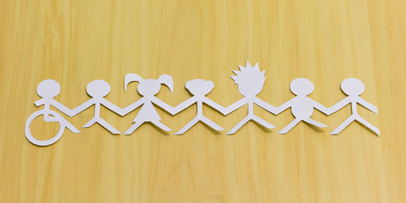 Paper cut out shapes of people